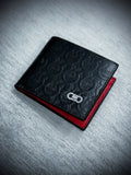 Billetera plegable negra Salvatore Ferragamo de cuero con relieve Gancini